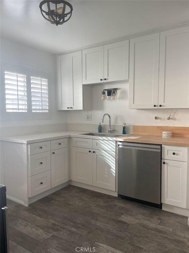 2109 Warfield Ave, Redondo Beach, CA 90278 - kitchen with stainless steel dishwasher, a sink, white cabinets, and dark wood-style floors