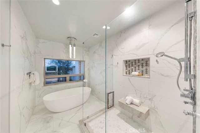 bathroom with visible vents, a marble finish shower, recessed lighting, a freestanding tub, and marble finish floor