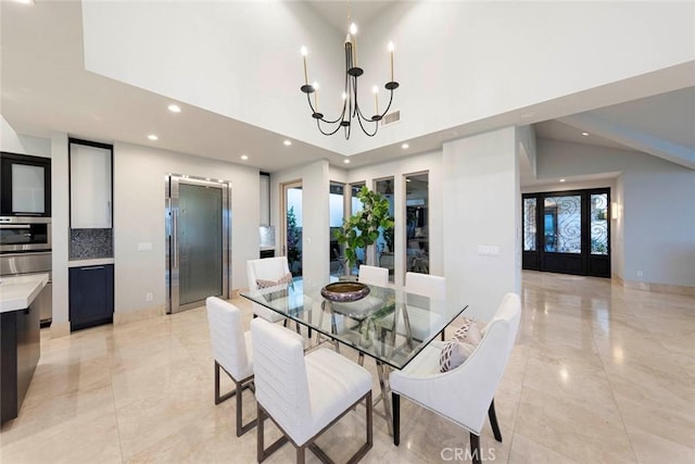dining room featuring recessed lighting, an inviting chandelier, marble finish floor, visible vents, and a high ceiling