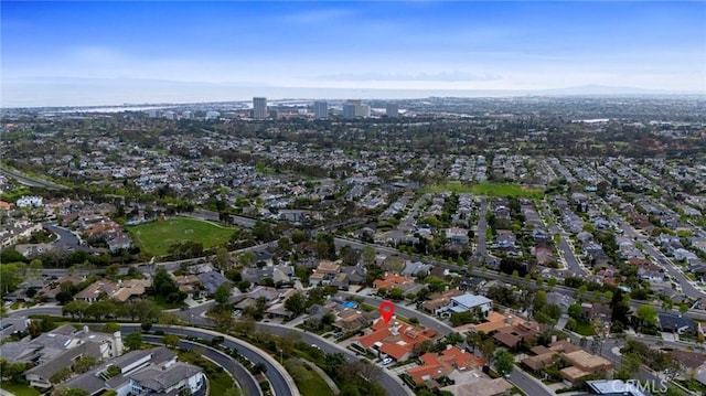birds eye view of property with a residential view