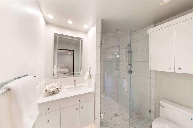 ensuite bathroom featuring toilet, connected bathroom, recessed lighting, and a shower stall