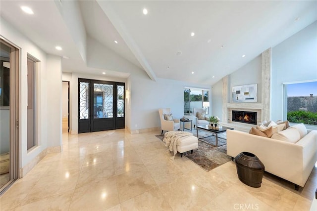 living area featuring recessed lighting, a large fireplace, high vaulted ceiling, and marble finish floor