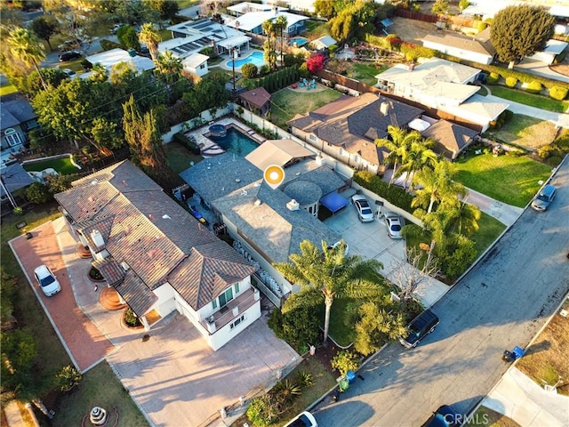 birds eye view of property with a residential view