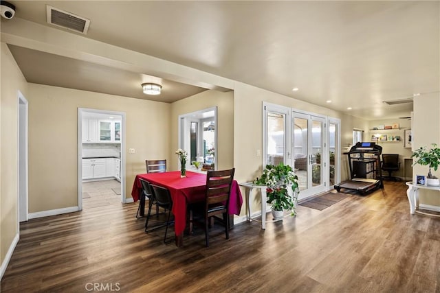 dining space featuring visible vents, french doors, baseboards, recessed lighting, and wood finished floors