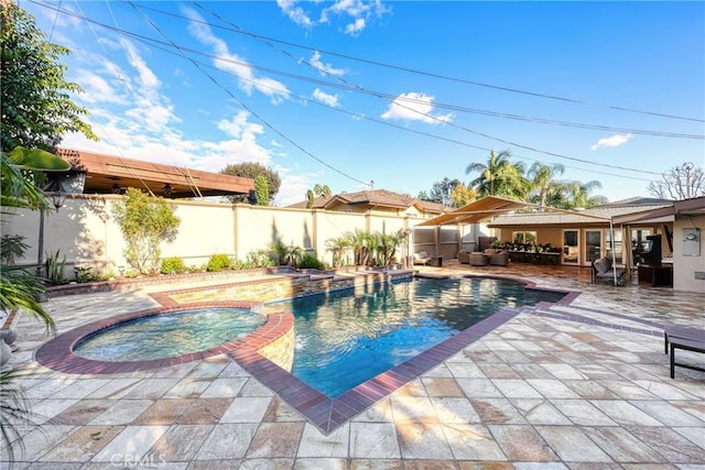 view of pool featuring an in ground hot tub, a patio, a fenced in pool, and a fenced backyard