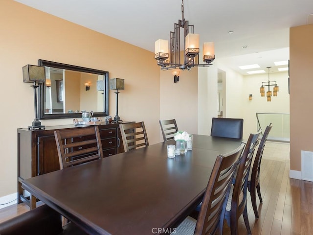 43 Avenida Corona, Rancho Palos Verdes, CA 90275 - dining space with visible vents, wood finished floors, a notable chandelier, and baseboards
