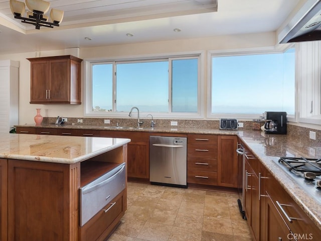 43 Avenida Corona, Rancho Palos Verdes, CA 90275 - kitchen with light stone counters, extractor fan, appliances with stainless steel finishes, a warming drawer, and a sink