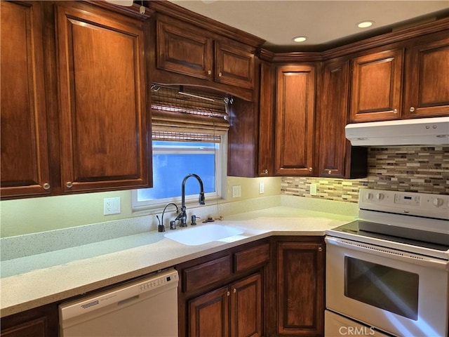443 Hartman Cir, Cedarpines Park, CA 92322 - kitchen featuring white appliances, under cabinet range hood, a sink, light countertops, and tasteful backsplash