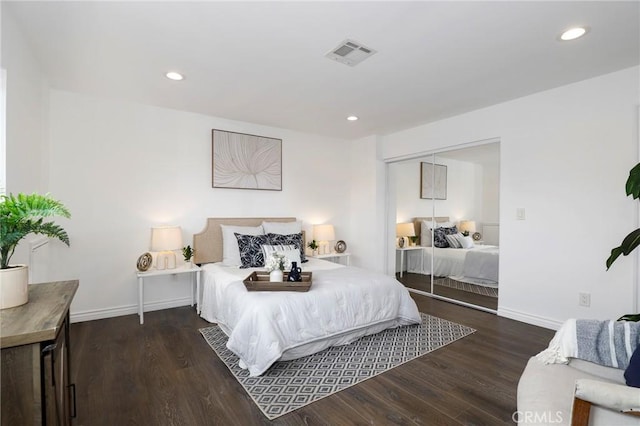 bedroom featuring recessed lighting, visible vents, and wood finished floors