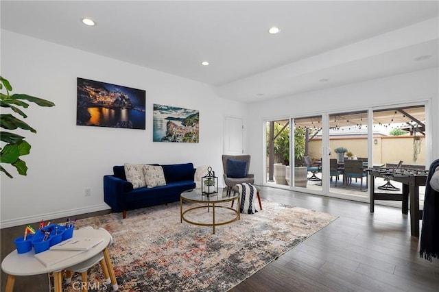 living area with recessed lighting, baseboards, and wood finished floors