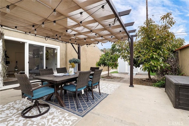 view of patio with outdoor dining area and a pergola