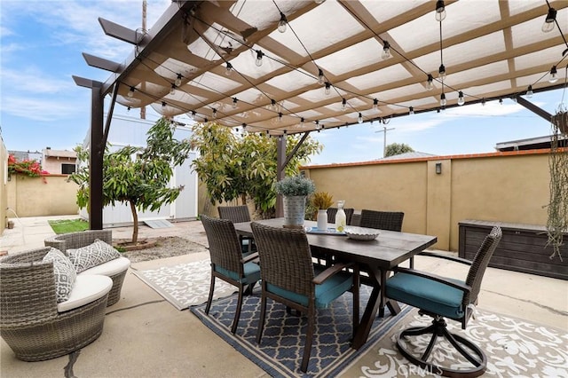 view of patio with a pergola and outdoor dining space