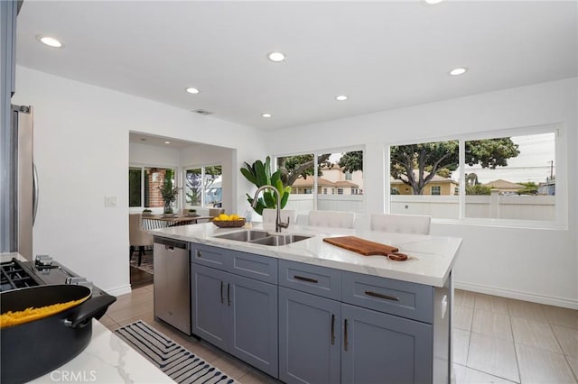 kitchen with a sink, stainless steel appliances, and recessed lighting