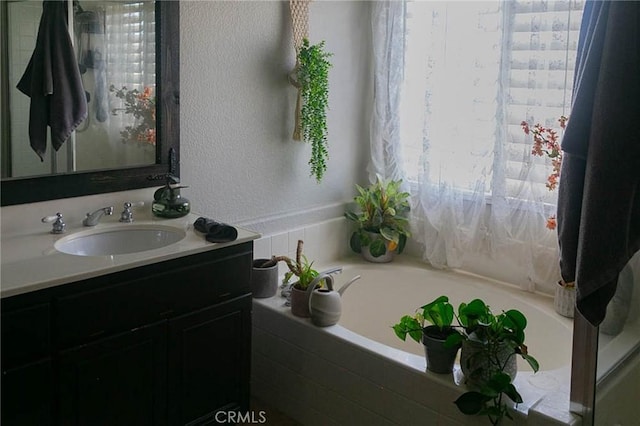 27069 Dawnview Ct, Corona, CA 92883 - full bath featuring a garden tub, a textured wall, and vanity
