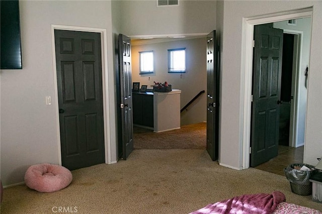 27069 Dawnview Ct, Corona, CA 92883 - hall with an upstairs landing, visible vents, baseboards, and carpet floors