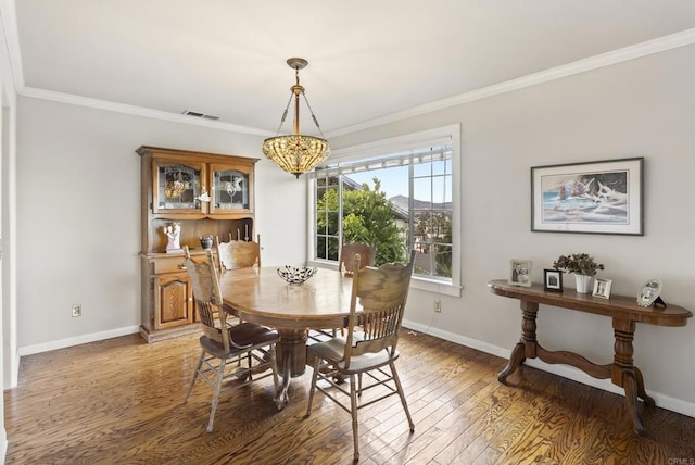 8140 Pasadena Ave, La Mesa, CA 91941 - dining space featuring crown molding, baseboards, light wood-type flooring, and visible vents