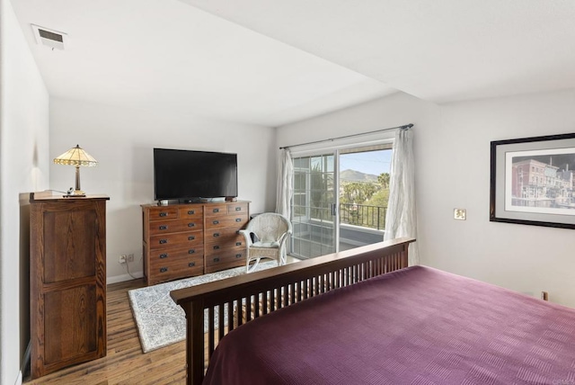 8140 Pasadena Ave, La Mesa, CA 91941 - bedroom with access to outside, baseboards, visible vents, and wood finished floors