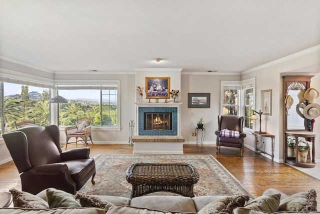 8140 Pasadena Ave, La Mesa, CA 91941 - living room featuring baseboards, a fireplace, crown molding, and wood finished floors