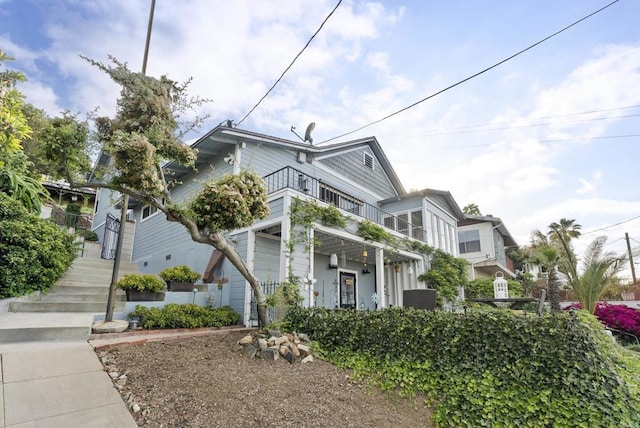 8140 Pasadena Ave, La Mesa, CA 91941 - view of front facade featuring central AC and a balcony