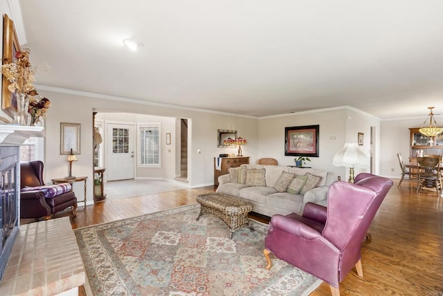 8140 Pasadena Ave, La Mesa, CA 91941 - living room featuring a tiled fireplace, wood finished floors, baseboards, and ornamental molding
