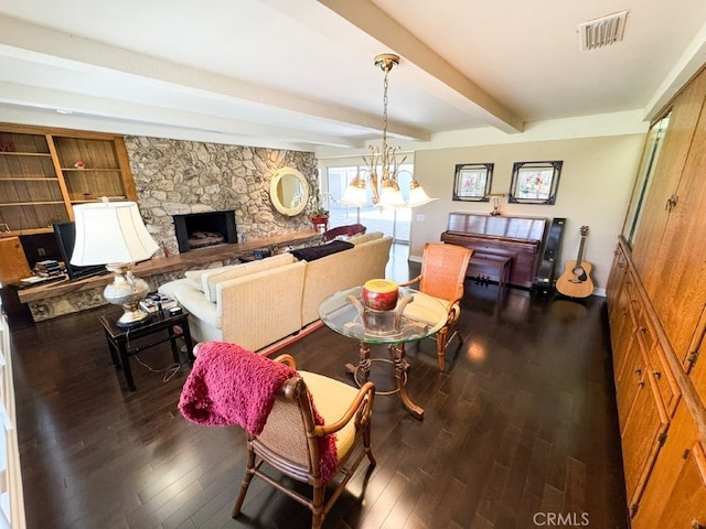 dining area with beam ceiling, a fireplace, dark wood-type flooring, visible vents, and baseboards