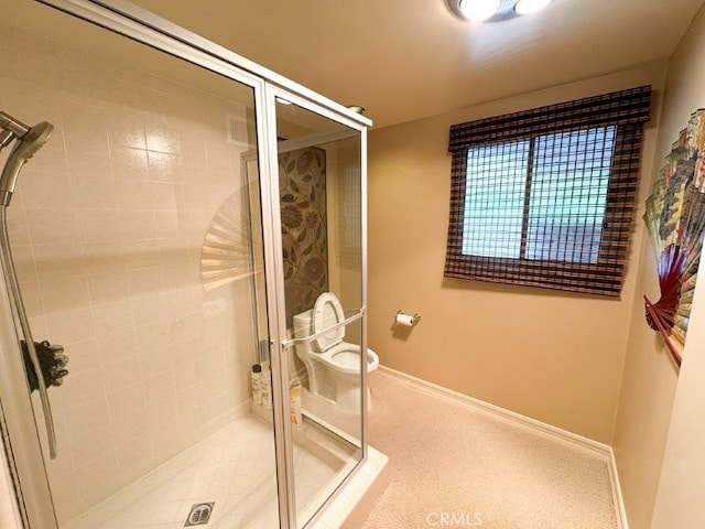 full bathroom featuring a stall shower and baseboards