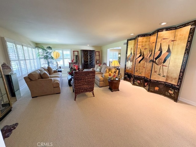 living room with recessed lighting, carpet, and baseboards