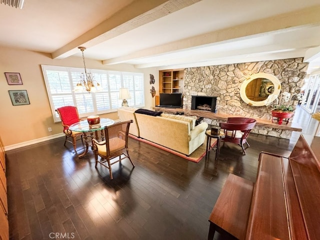 living area featuring beamed ceiling, baseboards, visible vents, a notable chandelier, and dark wood-type flooring