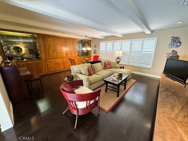 living room featuring beam ceiling, baseboards, visible vents, and wood-type flooring