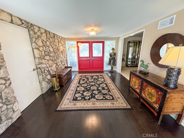 entryway featuring visible vents and hardwood / wood-style flooring
