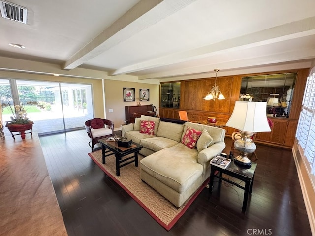 living room with beam ceiling, visible vents, a chandelier, and dark wood-style floors