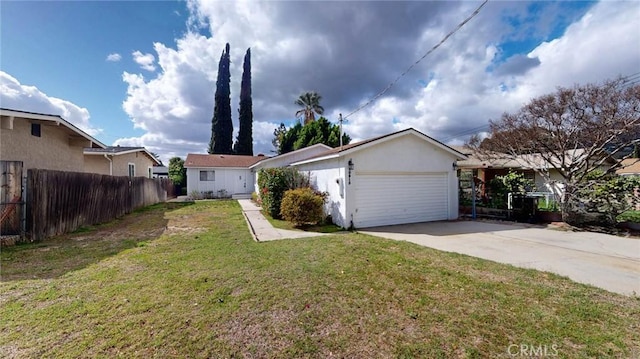 ranch-style home with concrete driveway, stucco siding, a front yard, an attached garage, and fence