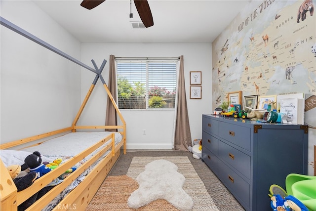 bedroom with baseboards, visible vents, a ceiling fan, and light colored carpet