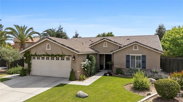 view of front of property with stucco siding, fence, a garage, a front lawn, and concrete driveway