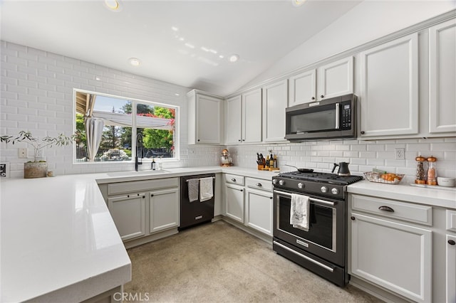 kitchen featuring range with gas stovetop, stainless steel microwave, decorative backsplash, a sink, and dishwasher