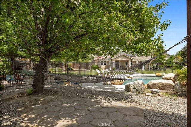 exterior space with fence and a fenced in pool