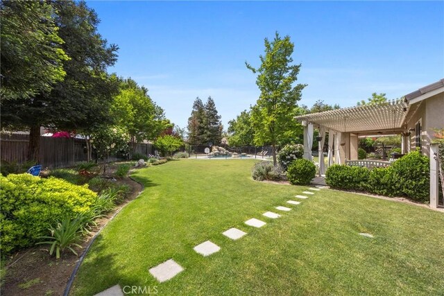 view of yard featuring a fenced backyard and a pergola