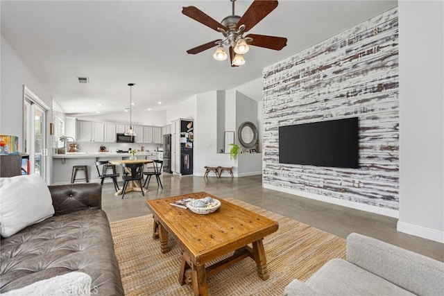 living room featuring ceiling fan, visible vents, baseboards, recessed lighting, and vaulted ceiling