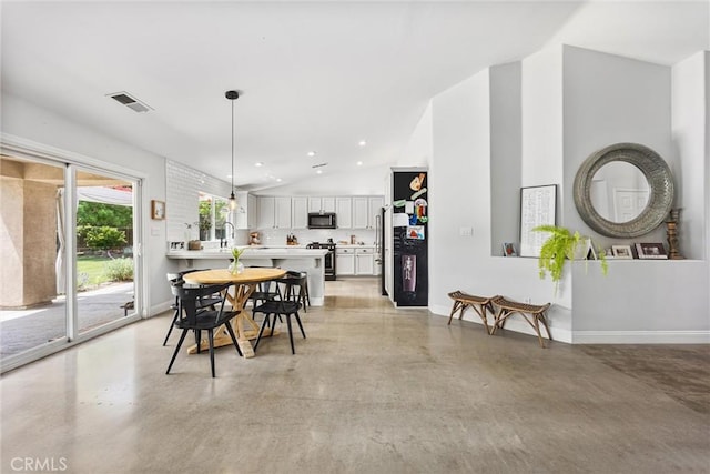 dining space with visible vents, baseboards, recessed lighting, concrete flooring, and high vaulted ceiling