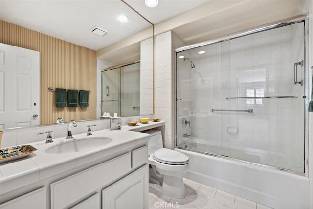 bathroom featuring recessed lighting, vanity, bath / shower combo with glass door, toilet, and tile patterned flooring