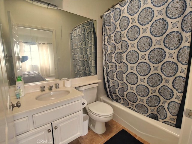bathroom featuring tile patterned floors, toilet, vanity, and shower / bath combination with curtain