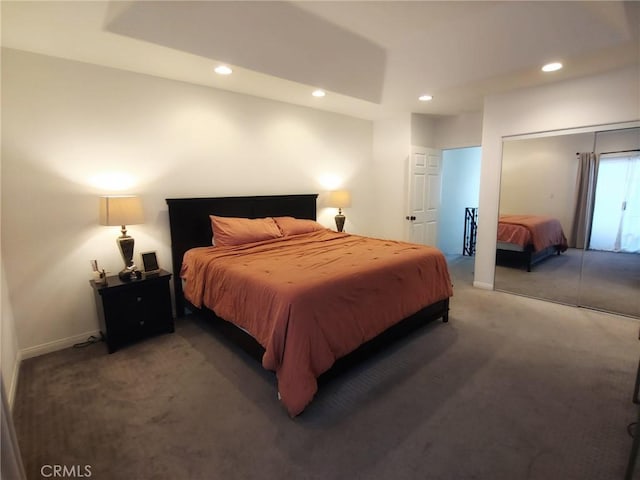 carpeted bedroom featuring recessed lighting, a closet, and baseboards