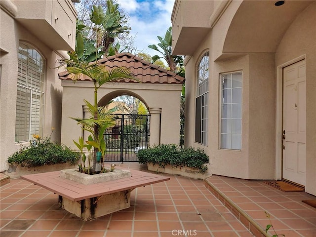 view of patio featuring a gate