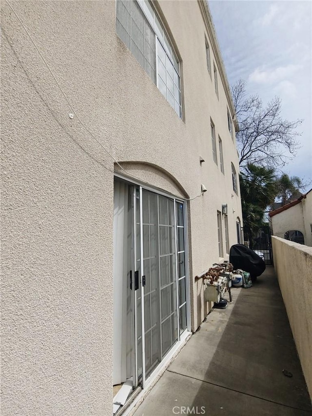 view of home's exterior with stucco siding