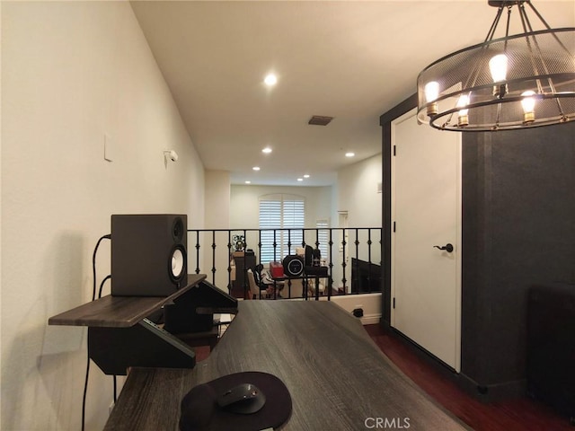 dining area with dark wood-style floors, a chandelier, and recessed lighting