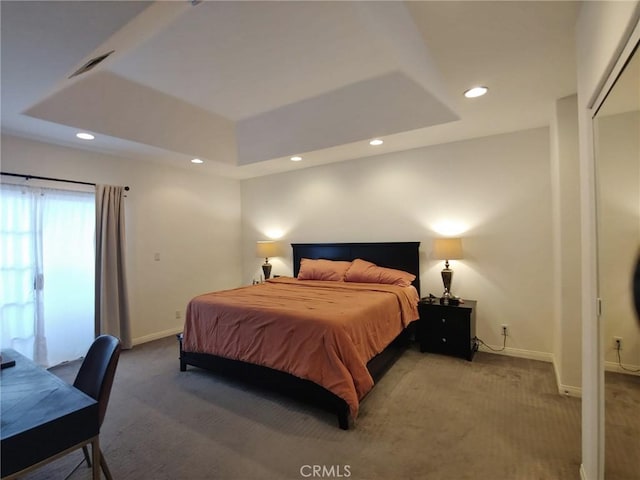 bedroom with carpet floors, baseboards, recessed lighting, and a tray ceiling