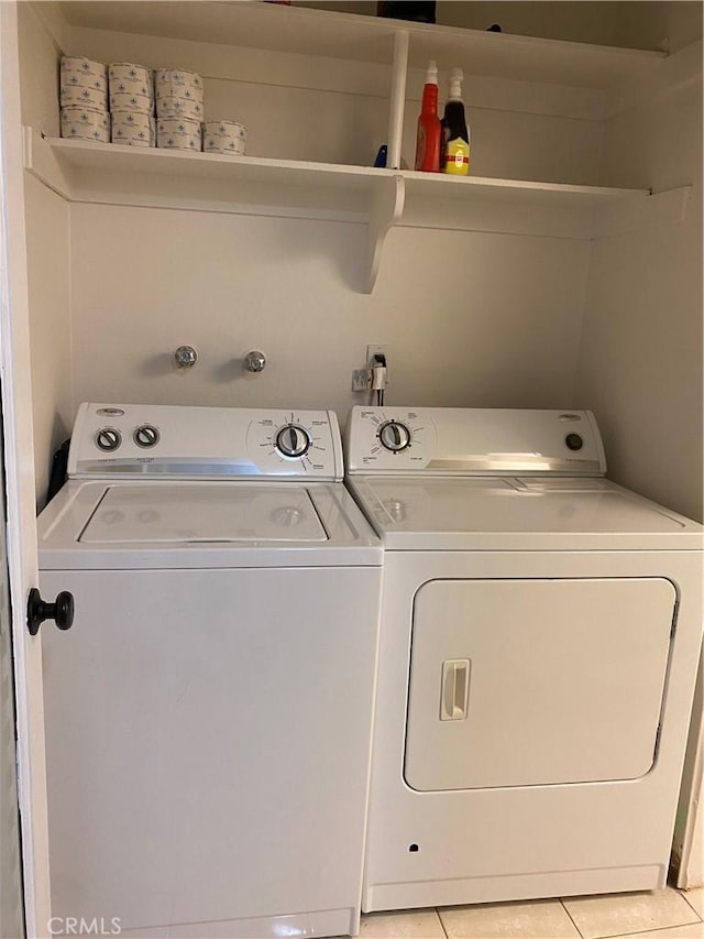 21040 Parthenia St Unit 13, Canoga Park, CA 91304 - laundry area featuring washer and clothes dryer and light tile patterned floors