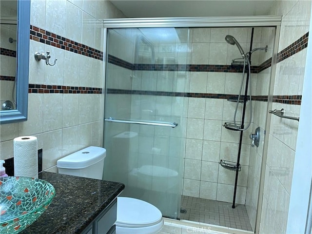21040 Parthenia St Unit 13, Canoga Park, CA 91304 - bathroom featuring toilet, tile walls, vanity, and a shower stall