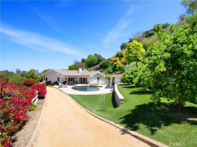 3 Poppy Trl, Rolling Hills, CA 90274 - back of property with a lawn, a patio area, and an outdoor pool