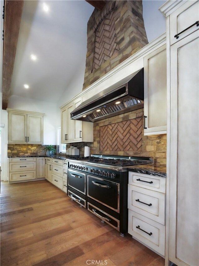 3 Poppy Trl, Rolling Hills, CA 90274 - kitchen featuring decorative backsplash, double oven range, range hood, vaulted ceiling, and cream cabinetry